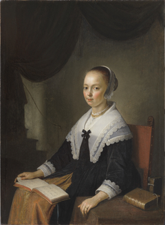 Portrait of a Lady, Seated with a Music Book on Her Lap by Gerrit Dou