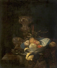 Still Life of Silver-Gilt Goblet, Porcelain Bowl, Glassware and Peeled Orange by Willem Kalf