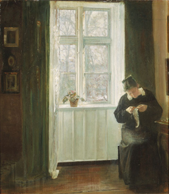 Interior with the artist's wife sowing at the window. by Carl Holsøe