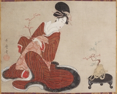 Woman Making a Flower Arrangement by Kitagawa Utamaro