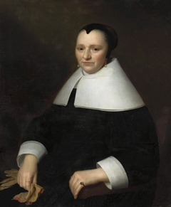 Portrait of a woman with gloves. by Isaack Luttichuys