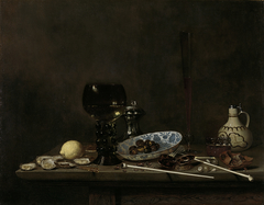 Still life with wineglass, flute, glass, earthenware jug and pipes by Jan Jansz van de Velde