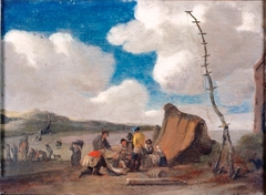 Strandgezicht met vissers rond een hut by Pieter de Valck