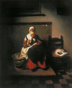 A Young Woman Sewing by Nicolaes Maes