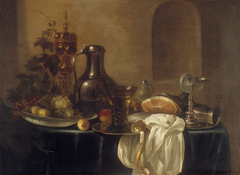 Still life with gilded silver bowl, nautilus shell cup and tin can by Cornelis Kruys