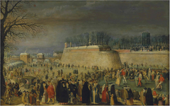 A winter carnival with figures on the ice before the Kipdorppoort Bastion in Antwerp by Sebastiaen Vrancx