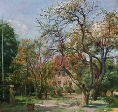 House in a garden with fruit trees in bloom by Carl Holsøe