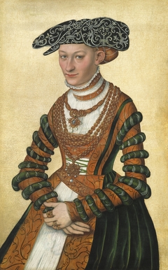 Portrait of a Lady in a green velvet and orange dress and a pearl-embroidered black hat by Lucas Cranach the Younger