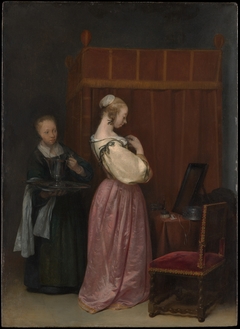 A Young Woman at Her Toilet with a Maid by Gerard ter Borch