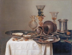 Still life with oysters, fallen jug and wine glasses by Willem Claesz Heda