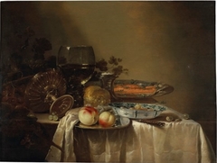 Still life with tazza, rummer, and kraak porcelain holding salmon and fruit by Adriaen Jansz Kraen