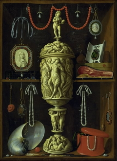 A collector's cabinet with ivory cup by Georg Hainz