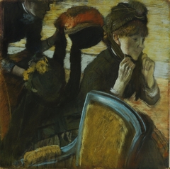 At the Milliner's by Edgar Degas