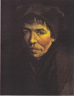 Head of a Peasant Woman with a dark hood by Vincent van Gogh